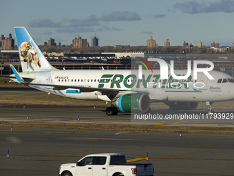 Frontier Airlines Airbus A320neo passenger aircraft spotted on final approach flying, landing and taxiing on the runway and taxiway of LaGua...