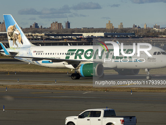 Frontier Airlines Airbus A320neo passenger aircraft spotted on final approach flying, landing and taxiing on the runway and taxiway of LaGua...