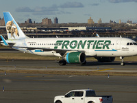 Frontier Airlines Airbus A320neo passenger aircraft spotted on final approach flying, landing and taxiing on the runway and taxiway of LaGua...