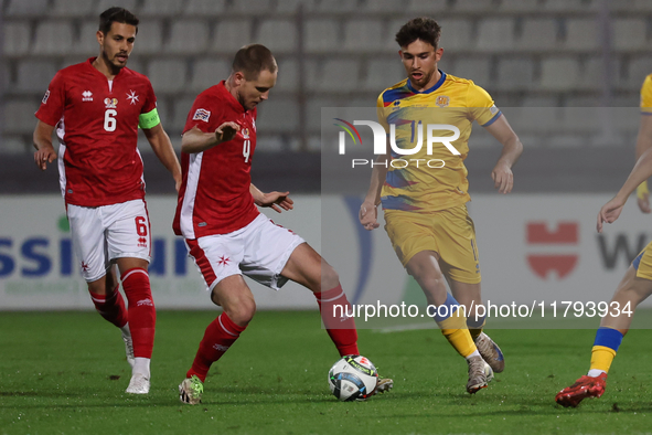 In Ta' Qali, Malta, on November 19, 2024, Garbiel Mentz of Malta is closely followed by Albert Rosas of Andorra during the UEFA Nations Leag...