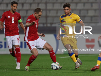 In Ta' Qali, Malta, on November 19, 2024, Garbiel Mentz of Malta is closely followed by Albert Rosas of Andorra during the UEFA Nations Leag...