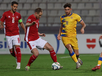 In Ta' Qali, Malta, on November 19, 2024, Garbiel Mentz of Malta is closely followed by Albert Rosas of Andorra during the UEFA Nations Leag...