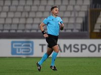 In Ta' Qali, Malta, on November 19, 2024, UEFA appoints match referee Luka Bilbija, who runs during the UEFA Nations League, League D, Group...