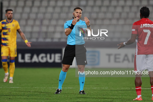 In Ta' Qali, Malta, on November 19, 2024, UEFA appoints match referee Luka Bilbija, who gestures during the UEFA Nations League, League D, G...