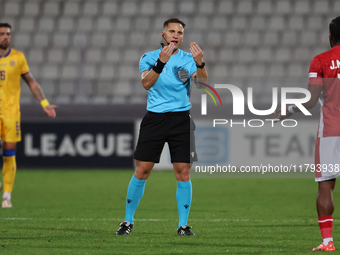 In Ta' Qali, Malta, on November 19, 2024, UEFA appoints match referee Luka Bilbija, who gestures during the UEFA Nations League, League D, G...