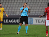 In Ta' Qali, Malta, on November 19, 2024, UEFA appoints match referee Luka Bilbija, who gestures during the UEFA Nations League, League D, G...