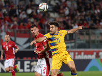 Albert Rosas of Andorra challenges Jean Borg of Malta for possession of the ball during the UEFA Nations League, League D, Group D2 soccer m...