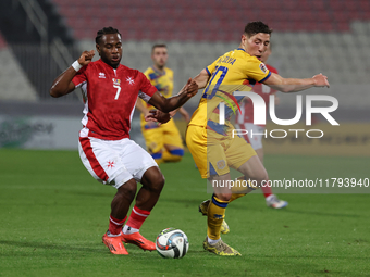 Joseph Mbong of Malta competes for the ball with Joao Da Silva of Andorra during the UEFA Nations League, League D, Group D2 soccer match be...