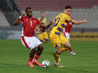 Joseph Mbong of Malta competes for the ball with Joao Da Silva of Andorra during the UEFA Nations League, League D, Group D2 soccer match be...