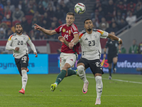 Barnabas Varga of Hungary competes for the ball with Benjamin Henrichs of Germany during the UEFA Nations League Group match at Puskas Arena...