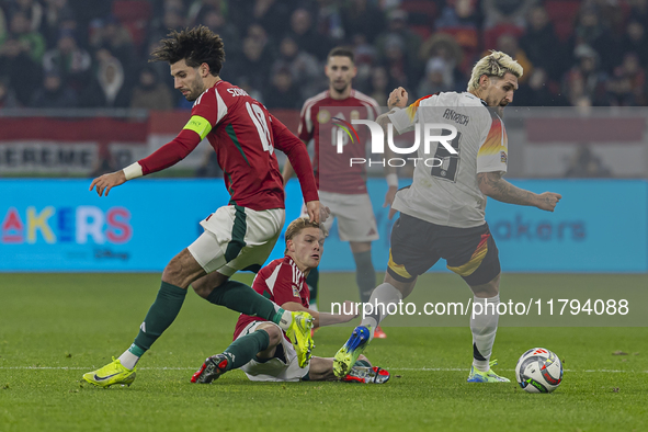 Andras Schafer of Hungary competes for the ball with Robert Andrich of Germany during the UEFA Nations League Group match at Puskas Arena in...