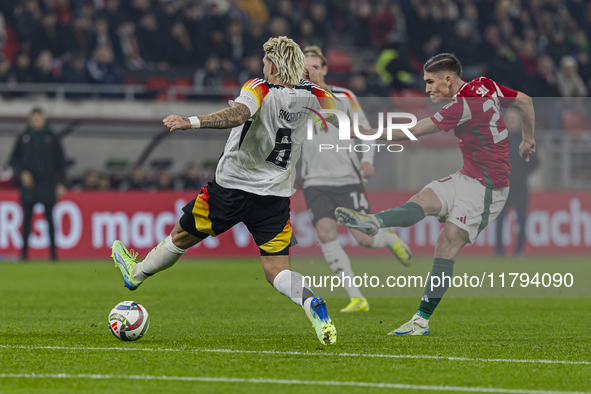 Roland Sallai of Hungary competes for the ball with Robert Andrich of Germany during the UEFA Nations League Group match at Puskas Arena in...