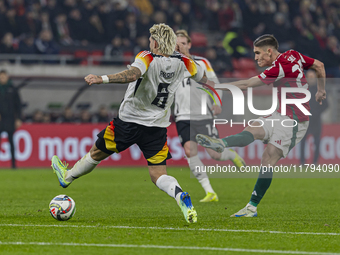 Roland Sallai of Hungary competes for the ball with Robert Andrich of Germany during the UEFA Nations League Group match at Puskas Arena in...