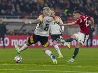 Roland Sallai of Hungary competes for the ball with Robert Andrich of Germany during the UEFA Nations League Group match at Puskas Arena in...