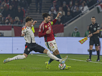 Robin Koch of Germany competes for the ball with Dominik Szoboszlai of Hungary during the UEFA Nations League Group match at Puskas Arena in...