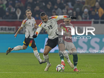 Leroy Sane of Germany competes for the ball with Zsolt Nagy of Hungary during the UEFA Nations League Group match at Puskas Arena in Budapes...