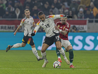 Leroy Sane of Germany competes for the ball with Zsolt Nagy of Hungary during the UEFA Nations League Group match at Puskas Arena in Budapes...