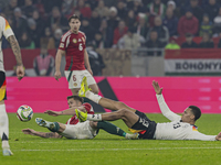 Felix Nmecha of Germany competes for the ball with Tamas Nikitscher of Hungary during the UEFA Nations League Group match at Puskas Arena in...