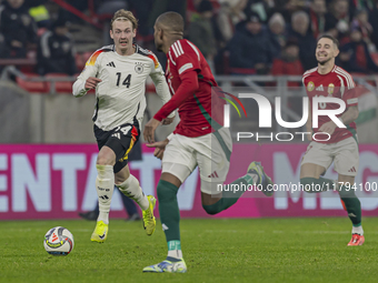 Julian Brandt of Germany competes for the ball with Loic Nego of Hungary during the UEFA Nations League Group match at Puskas Arena in Budap...