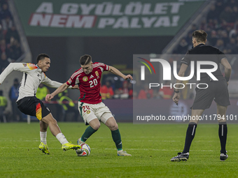 Roland Sallai of Hungary competes for the ball with Felix Nmecha of Germany during the UEFA Nations League Group match at Puskas Arena in Bu...