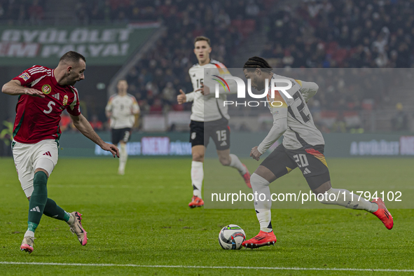 Serge Gnabry of Germany competes for the ball with Attila Fiola of Hungary during the UEFA Nations League Group match at Puskas Arena in Bud...