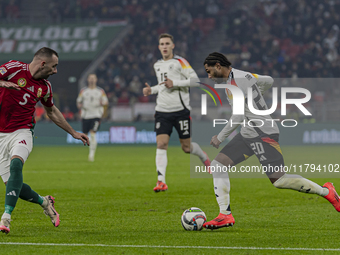 Serge Gnabry of Germany competes for the ball with Attila Fiola of Hungary during the UEFA Nations League Group match at Puskas Arena in Bud...