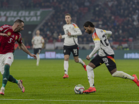 Serge Gnabry of Germany competes for the ball with Attila Fiola of Hungary during the UEFA Nations League Group match at Puskas Arena in Bud...