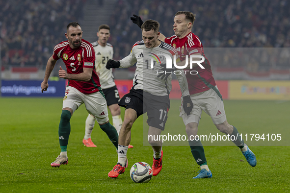 Florian Wirtz of Germany competes for the ball with Daniel Gera of Hungary during the UEFA Nations League Group match at Puskas Arena in Bud...