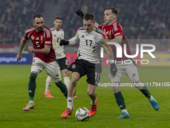 Florian Wirtz of Germany competes for the ball with Daniel Gera of Hungary during the UEFA Nations League Group match at Puskas Arena in Bud...