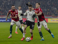 Florian Wirtz of Germany competes for the ball with Daniel Gera of Hungary during the UEFA Nations League Group match at Puskas Arena in Bud...