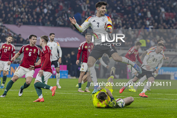 Goalkeeper of Hungary, Denes Dibusz, saves against Kai Havertz during the UEFA Nations League Group match at Puskas Arena in Budapest, Hunga...