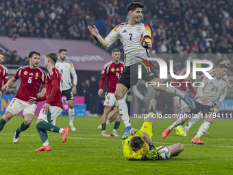 Goalkeeper of Hungary, Denes Dibusz, saves against Kai Havertz during the UEFA Nations League Group match at Puskas Arena in Budapest, Hunga...