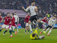 Goalkeeper of Hungary, Denes Dibusz, saves against Kai Havertz during the UEFA Nations League Group match at Puskas Arena in Budapest, Hunga...