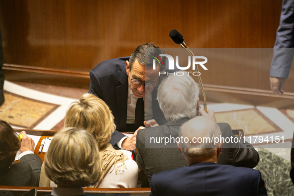 In Paris, France, on November 19, 2024, Bruno Retailleau, Minister for the Interior, speaks to Prime Minister Michel Barnier during the ques...