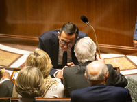 In Paris, France, on November 19, 2024, Bruno Retailleau, Minister for the Interior, speaks to Prime Minister Michel Barnier during the ques...