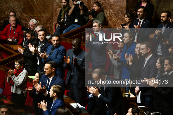 In Paris, France, on November 19, 2024, deputies of the leftist parliamentary group La France Insoumise applaud the speech of Emmanuel Ferna...