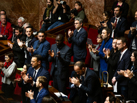 In Paris, France, on November 19, 2024, deputies of the leftist parliamentary group La France Insoumise applaud the speech of Emmanuel Ferna...