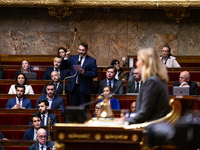 Thibaut Monnier, deputy of the Rassemblement National group, speaks during the session of questions to the French government at the National...