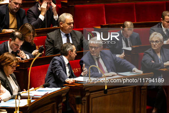 Bruno Retailleau, Minister for the Interior, speaks to Patrick Hetzel, Minister of Higher Education and Research, during the questions to th...