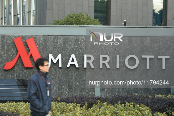 A citizen walks past a Marriott International hotel in Hangzhou, China, on November 20, 2024. 