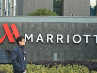 A citizen walks past a Marriott International hotel in Hangzhou, China, on November 20, 2024. (