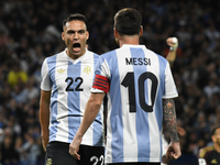 Lautaro Martinez and Lionel Messi of Argentina celebrate their team's goal during the match between Argentina and Peru at Alberto J. Armando...