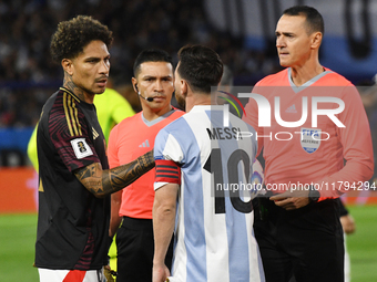 Paolo Guerrero of Peru and Lionel Messi of Argentina shake hands before the match between Argentina and Peru at Alberto J. Armando - La Bomb...