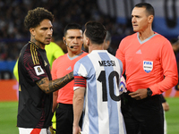 Paolo Guerrero of Peru and Lionel Messi of Argentina shake hands before the match between Argentina and Peru at Alberto J. Armando - La Bomb...