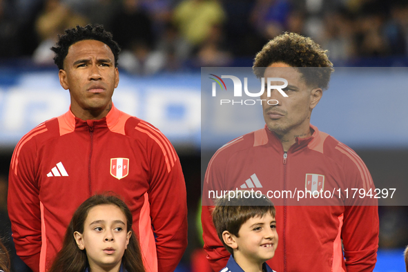 Pedro Gallese and Paolo Guerrero of Peru stand during the national anthems ceremony before the match between Argentina and Peru at Alberto J...