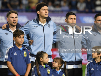 Alexis Mac Allister, Leonardo Balerdi, Gonzalo Montiel, and Nicolas Tagliafico of Argentina stand during the national anthems ceremony befor...