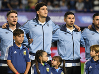 Alexis Mac Allister, Leonardo Balerdi, Gonzalo Montiel, and Nicolas Tagliafico of Argentina stand during the national anthems ceremony befor...