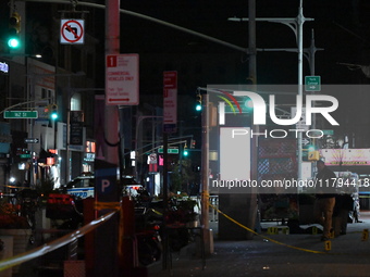 Evidence markers mark the scene where a police-involved shooting occurs in Jamaica, Queens, United States, on November 19, 2024. At 5:35 pm,...