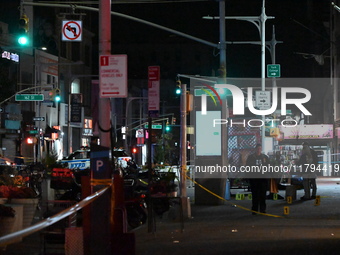 Evidence markers mark the scene where a police-involved shooting occurs in Jamaica, Queens, United States, on November 19, 2024. At 5:35 pm,...