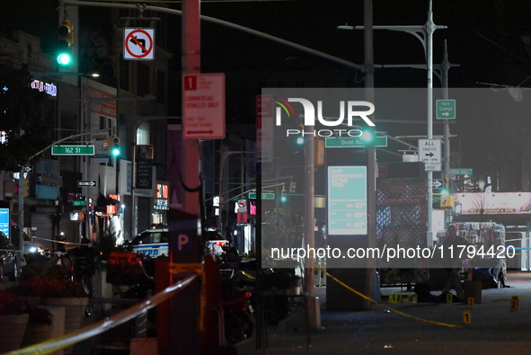 Evidence markers mark the scene where a police-involved shooting occurs in Jamaica, Queens, United States, on November 19, 2024. At 5:35 pm,...